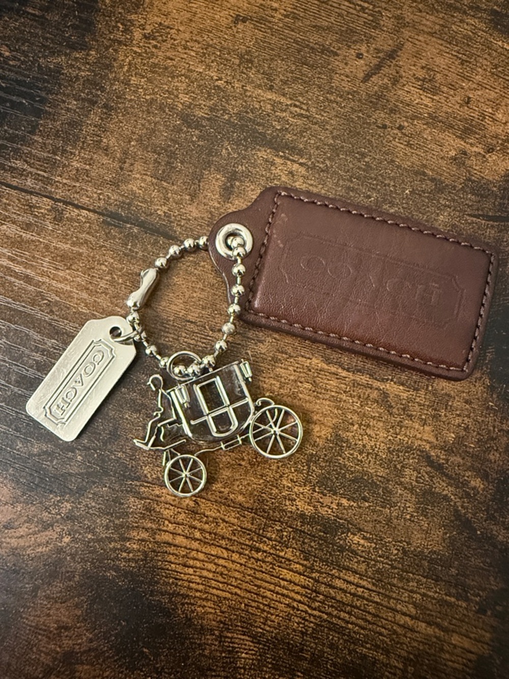 Coach Brown Leather Tag with silver-Tone Carriage Charm Keyring